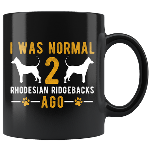 I Was Normal 2 Rhodesian Ridgebacks Ago 11oz Black Mug