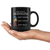 How To Be A Triathlete Don't Drown Don't Crash Don't Walk 11oz Black Mug